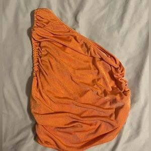 One shoulder cropped shimmer top.